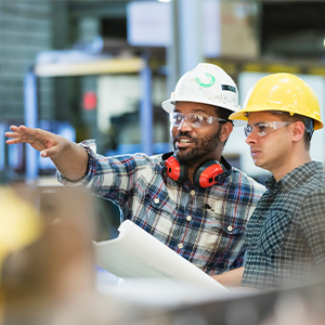 factory layout being shown by worker